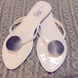 White sandals by 385 Fifth